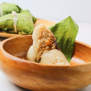 delicious Thai sticky rice dumpling on a wooden bowl