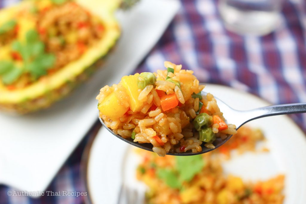 a spoonful of pineapple fried rice