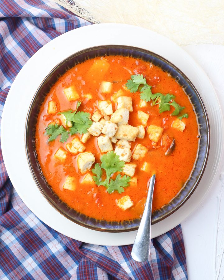 Tom Yum Soup on a checkered towel on a white table