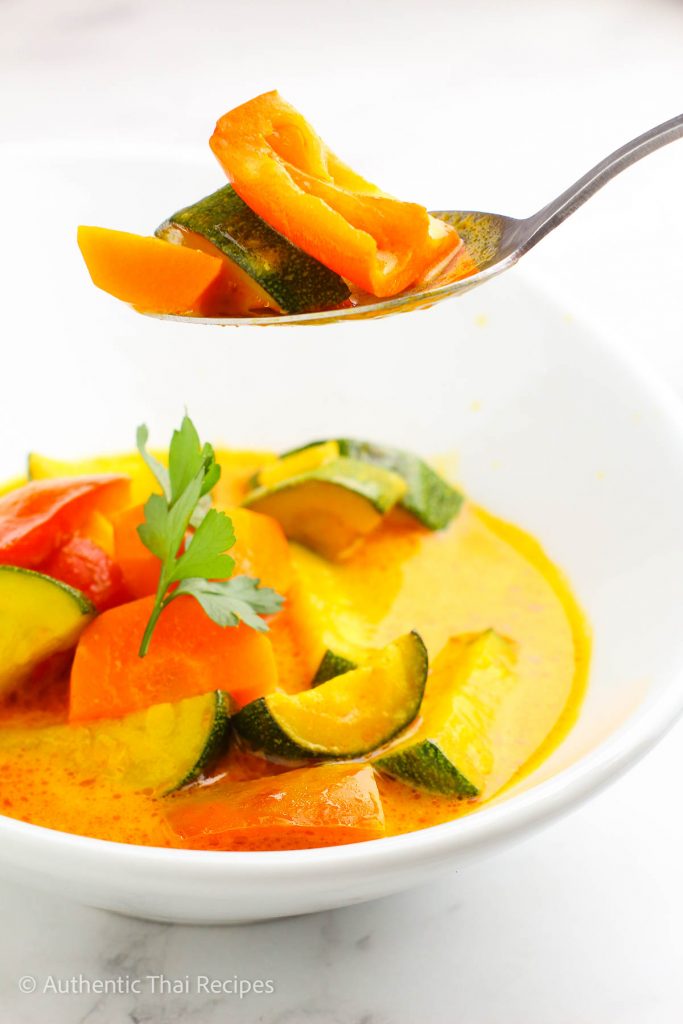 Vegan Panang Curry in a white bowl on a marble table