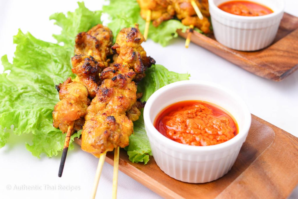 Chicken Satay on a wooden plate