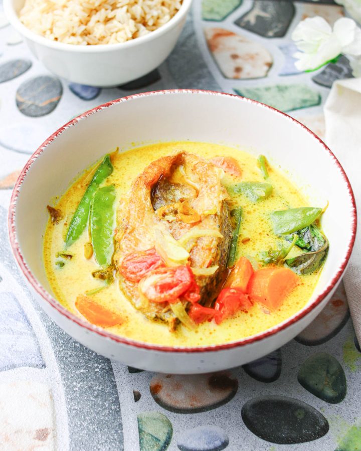 delicious thai fish curry in a white bowl