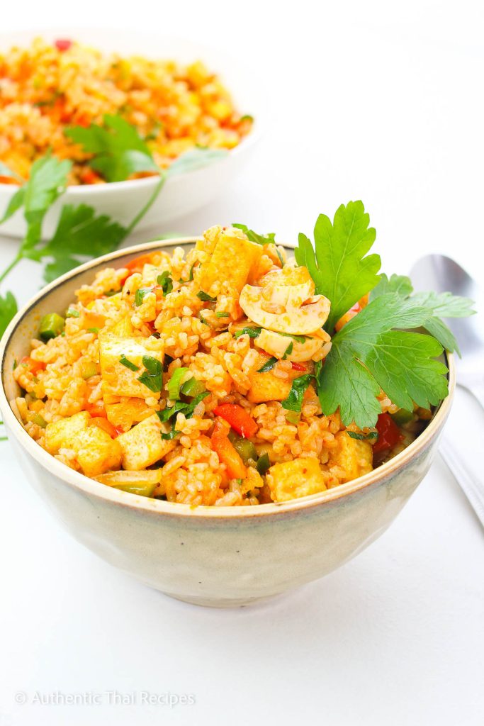 Tom Yum Fried rice in a bowl garnished with cilantro