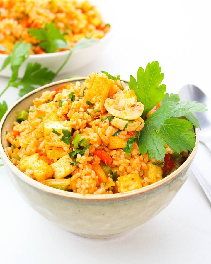 two bowls of Tom Yum Fried Rice on a white table